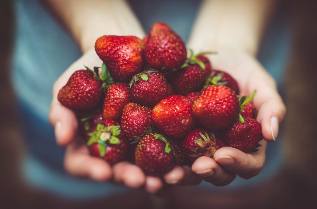 strawberries in hand