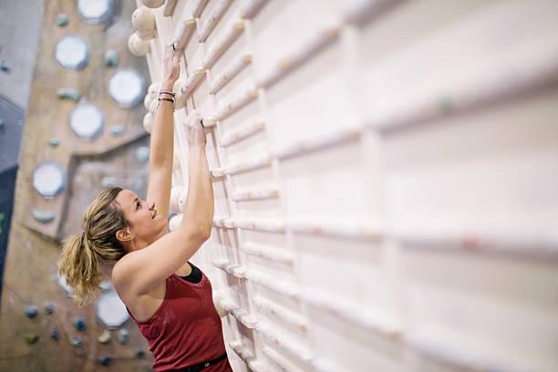 Indoor climbing in the bouldering gym wall. Indoor climbing in the bouldering gym wall. obstacle gym stock pictures, royalty-free photos & images
