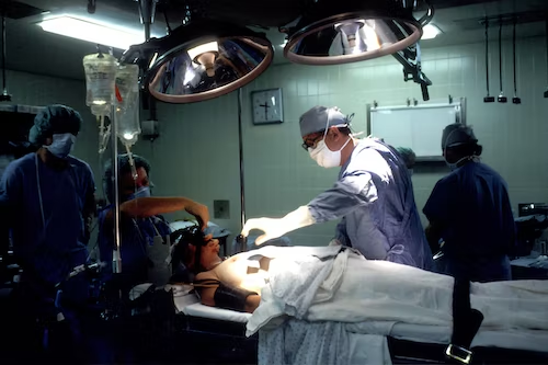 Doctors performing plastic surgery