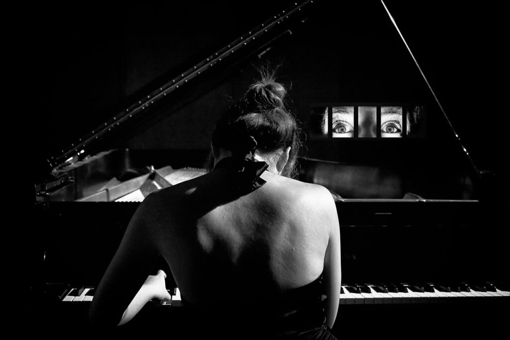 Black and white woman playing piano