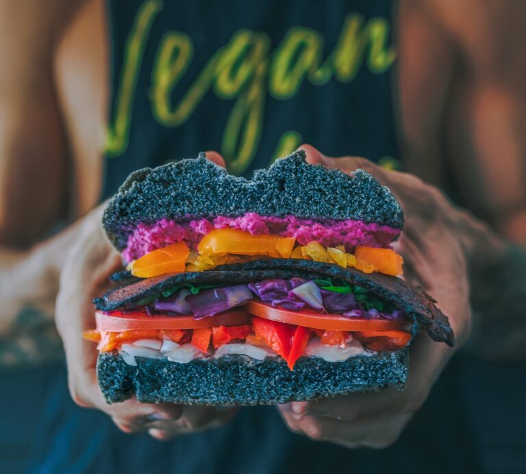 Man in vegan t shirt with vegan burger