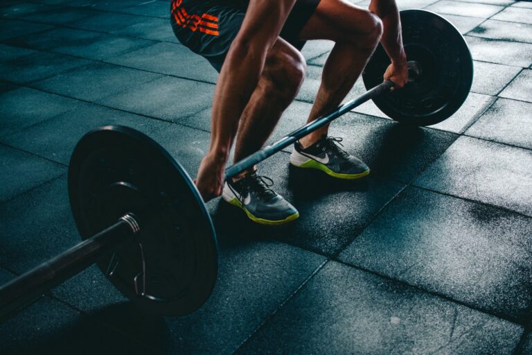 Man lifting weights in gym