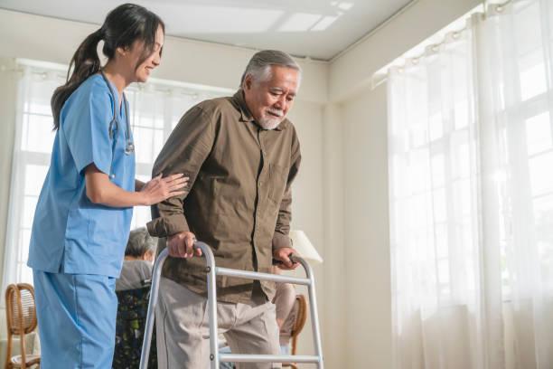 nurse helping old man 