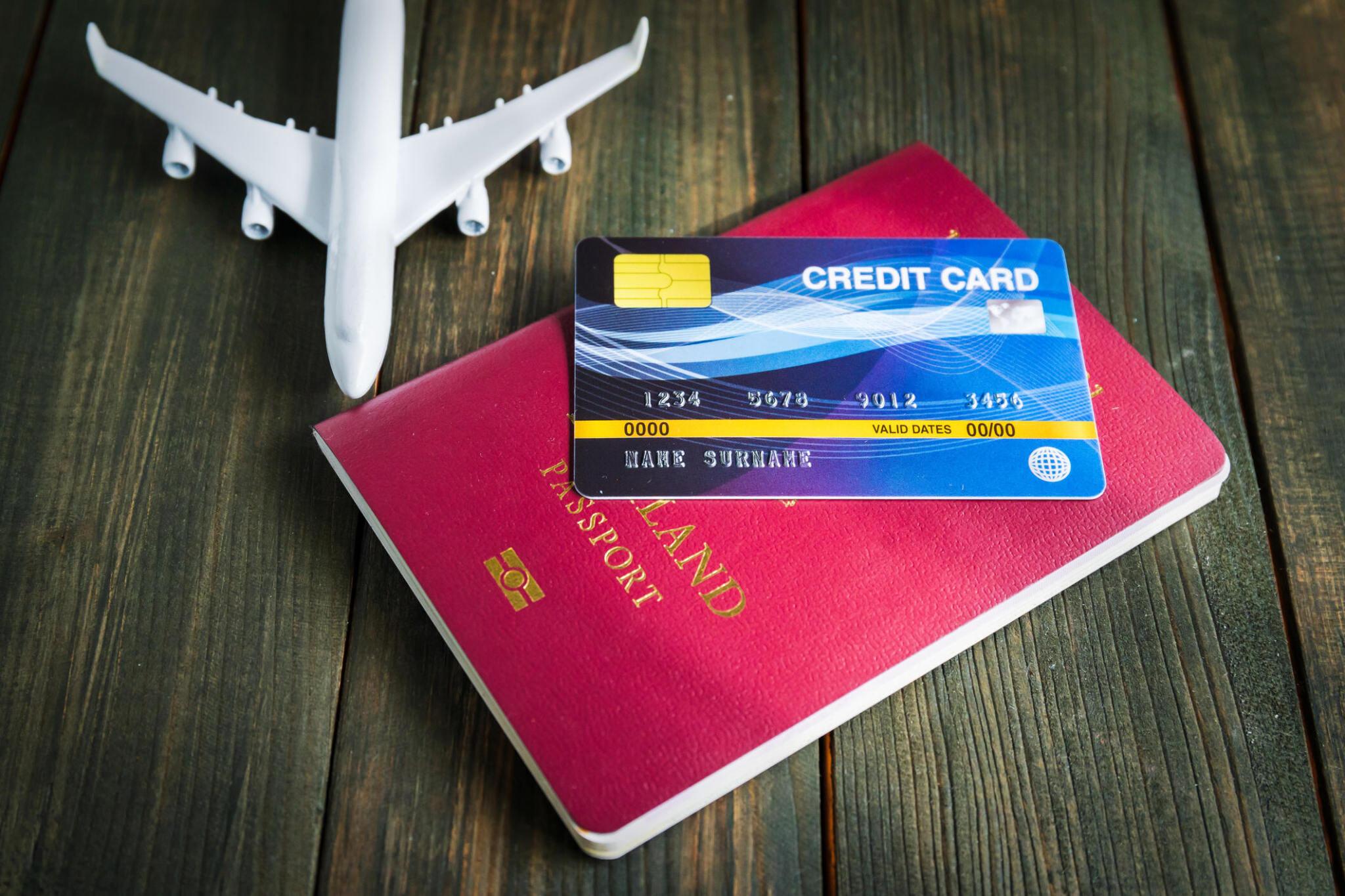 Visa card, notebook and a airplane toy