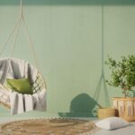 Classic green themed room with hanging chairs