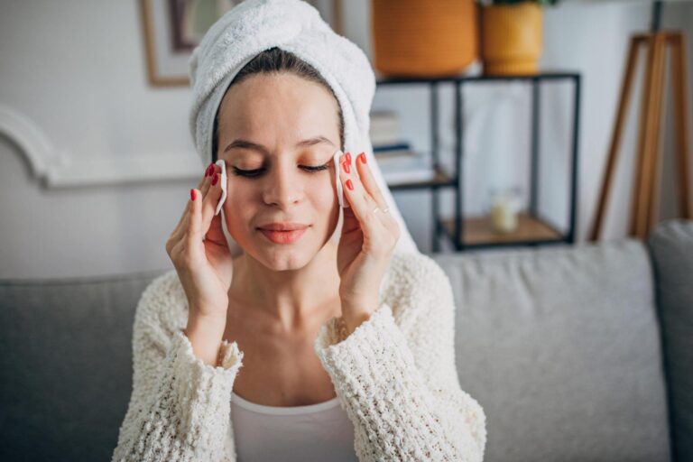 Woman applying cleansers on dry skin