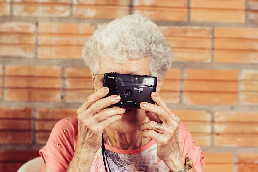 old woman clicking a photgraph