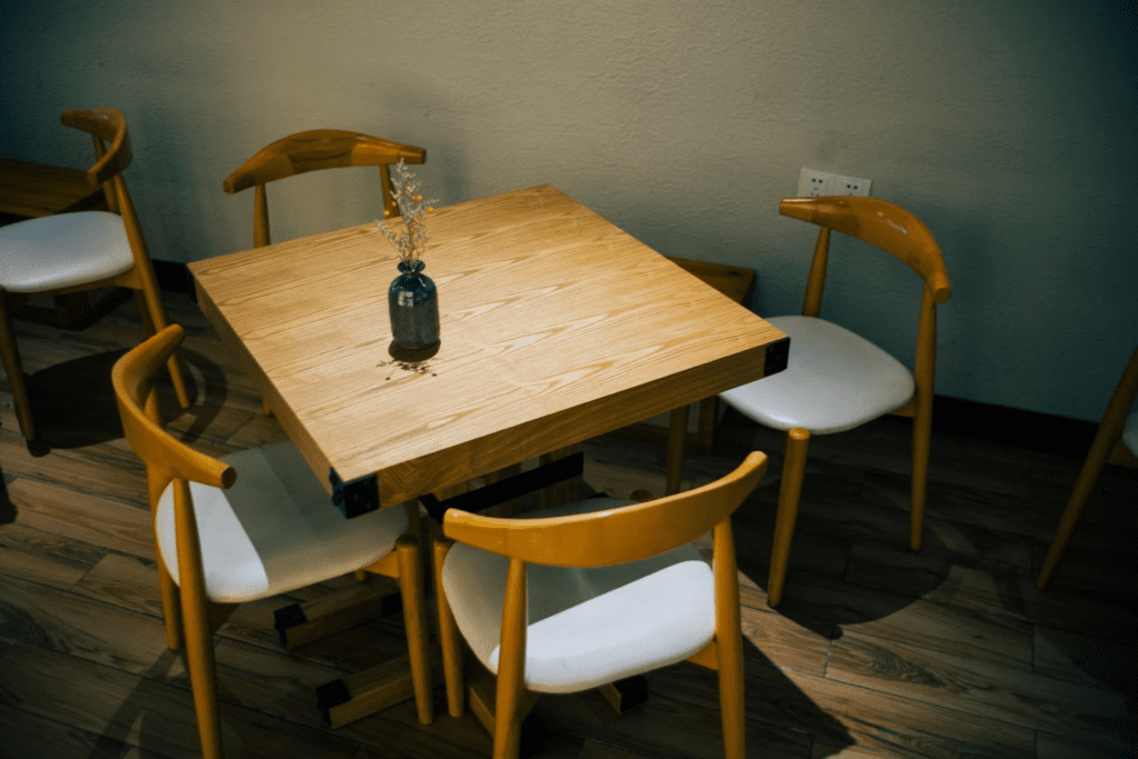 brown wooden table with chairs
