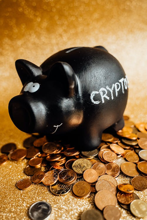 Black piggy bank with crypto written on it