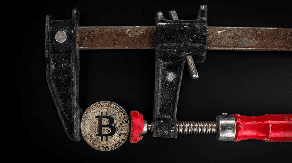 Black and Red Caliper on Gold-colored Bitcoin
